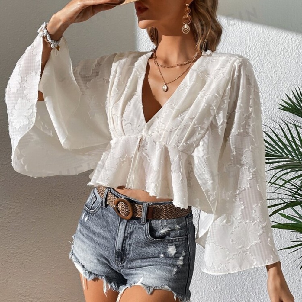 White floral embroidered bell sleeve blouse with V neck and flared sleeves